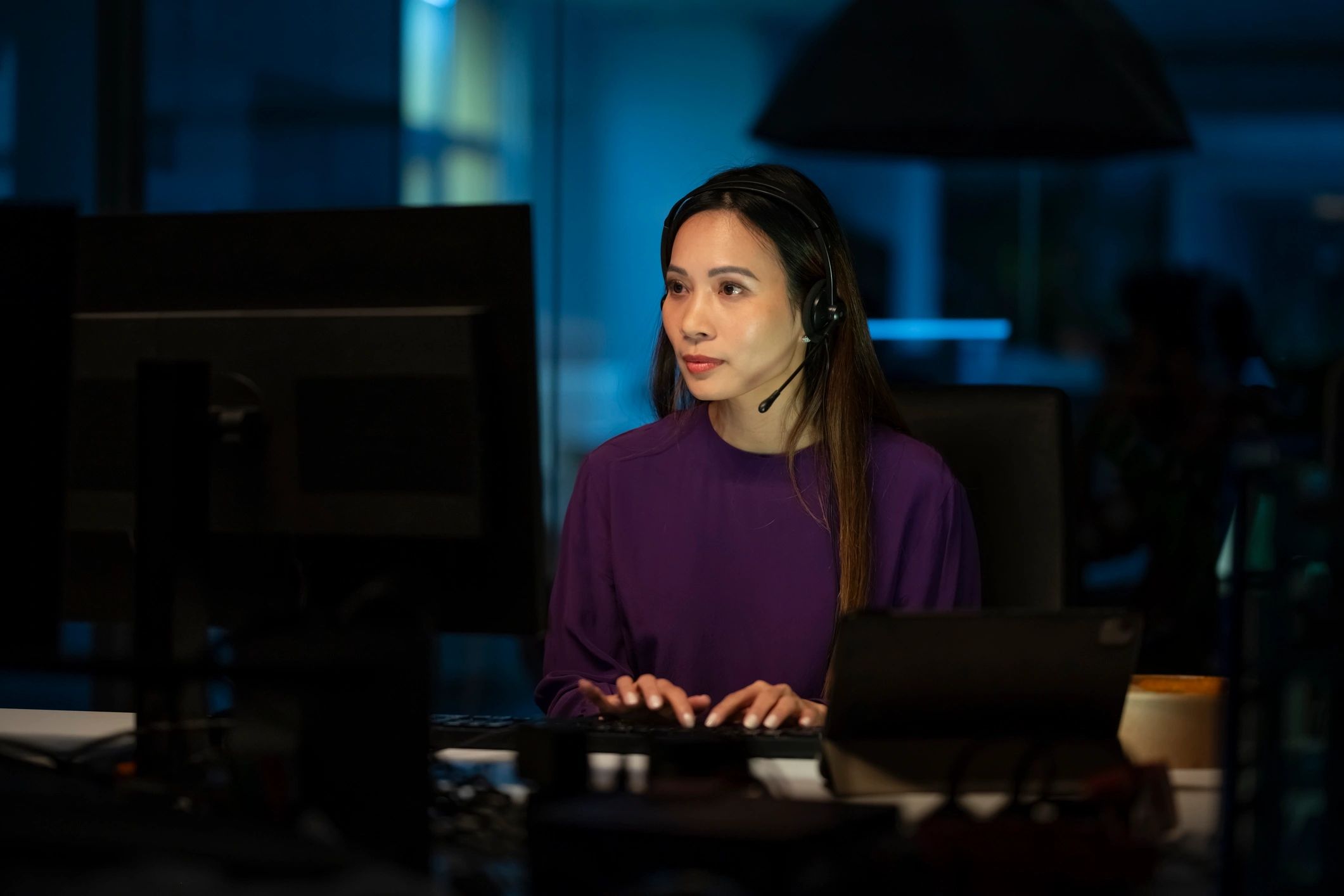 Young businesswoman working late in office